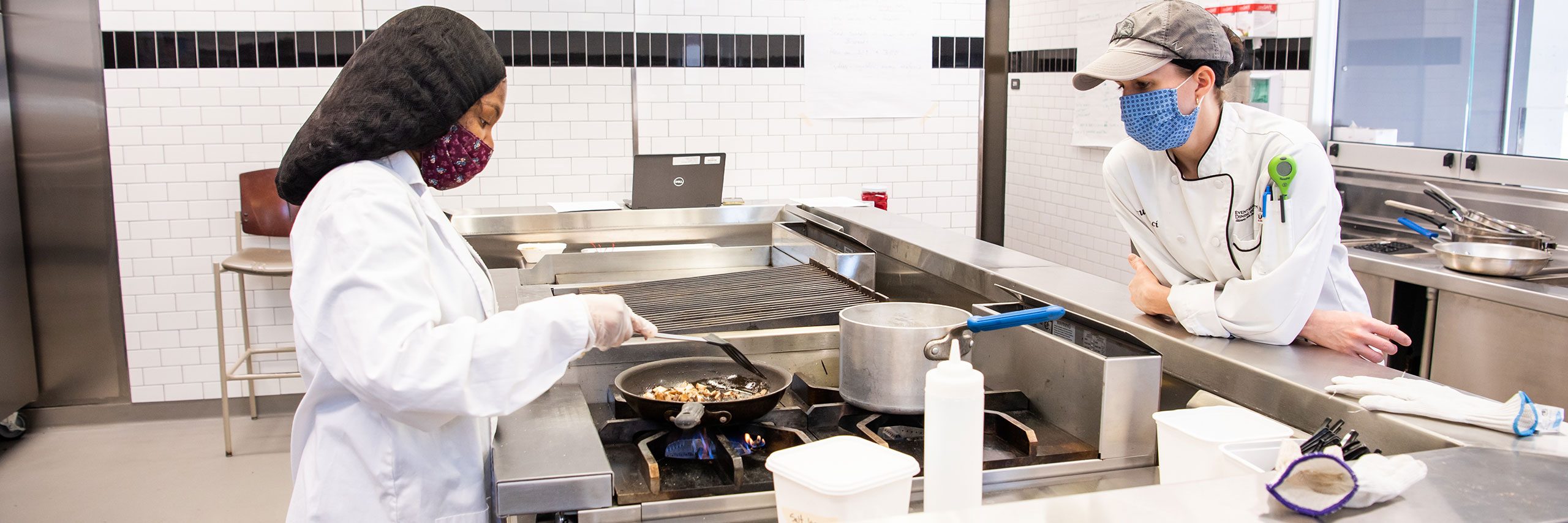 Students working on a commercial kitchen.